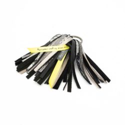 Close-up of a black and silver leather palm tree accessory.