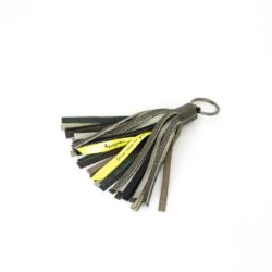Tassel keychain made of grey and silver leather scaps.